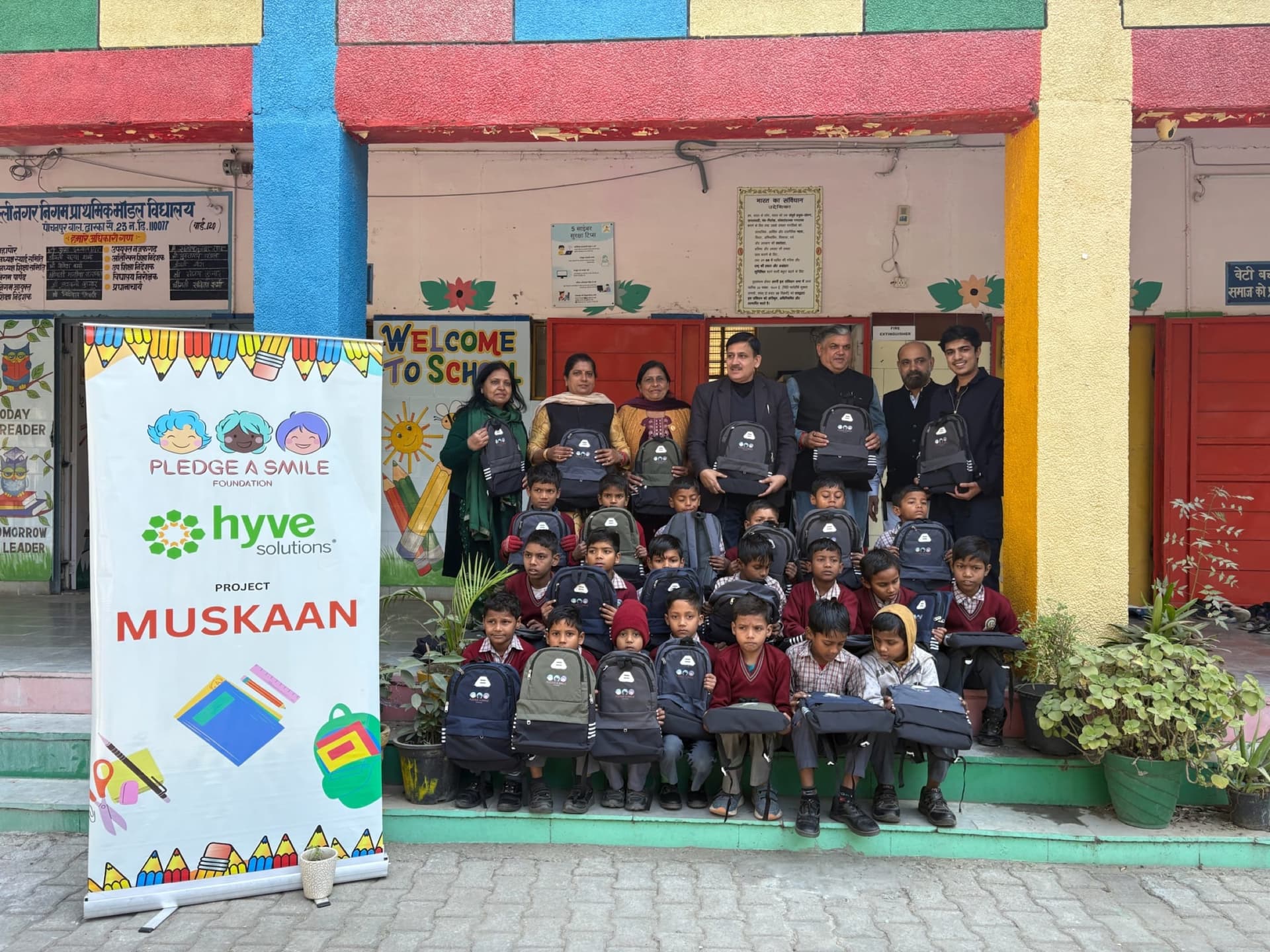 Backpack handover group against rainbow-painted school walls - color pop
